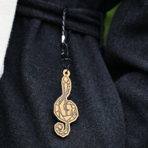 Kultainen heijastava riipus “Nuottiavain”