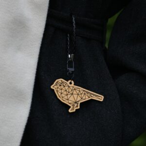 Kultainen hohtava riipus "Lintu"